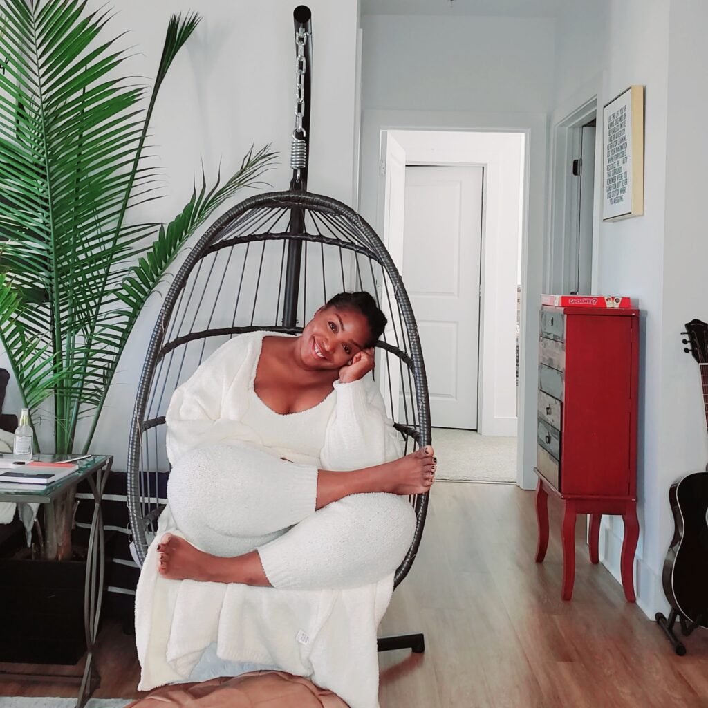 la sitting in her egg chair