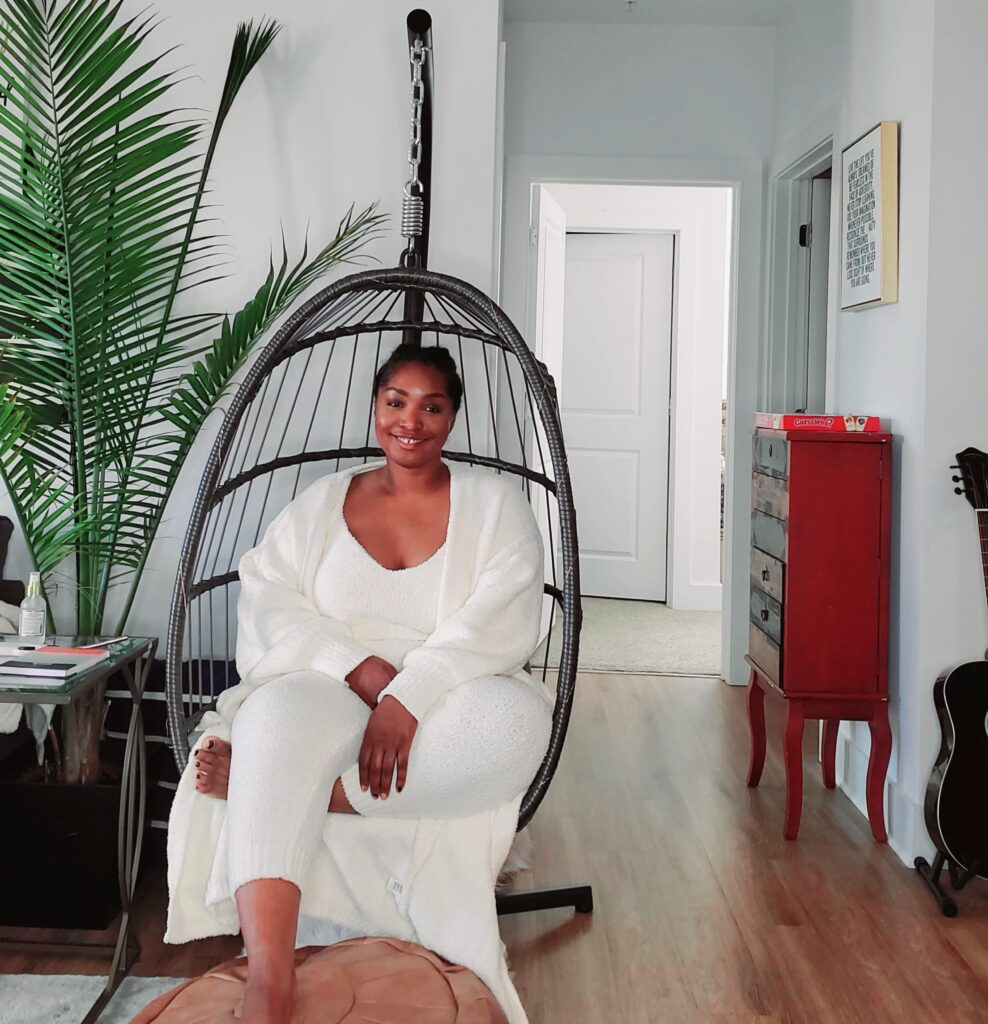 la sitting in her egg chair